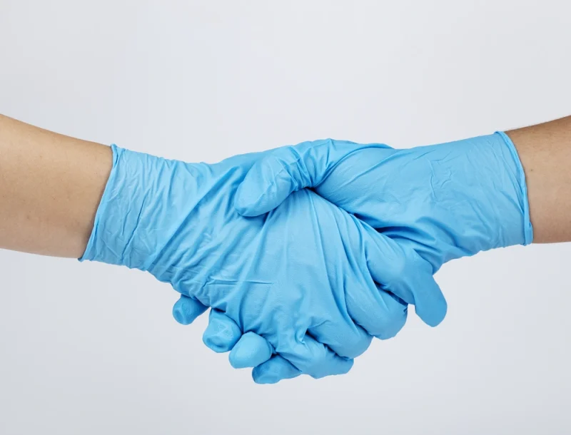 medical-staff-shaking-hands-coronavirus-pandemic-ezgif.com-optiwebp